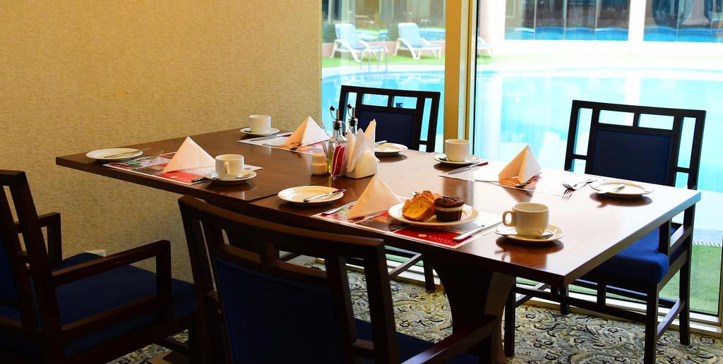 Ramada Hotel & Suites By Wyndham Al Qassim Al Bukayriah Esterno foto A table set for afternoon tea